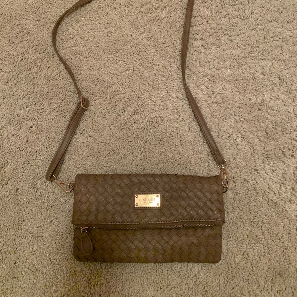 Taupe colored crossbody bag with adjustable strap